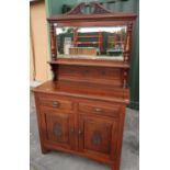 Late Victorian mahogany dresser with raised bevelled edged mirror back with shelf above two