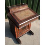 Victorian walnut and ebonised Davenport with lift up top revealing fitted interior above slope