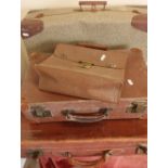 Selection of various leather and other vintage suitcases and luggage