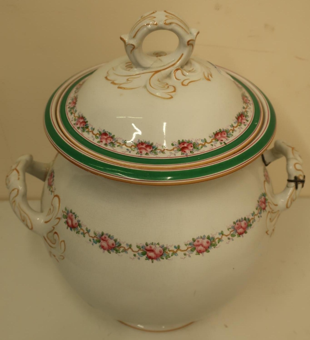 Late 19th C twin handled vase with lift off cover, floral detail and old stapled repair to handle,