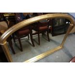 Gilt framed oval mantel mirror (width 125cm)