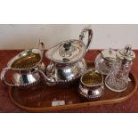 Silver plated teapot, sugar bowl, milk jug etc, on a small wooden tray