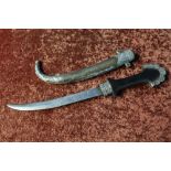 Arabian style dagger with 9 1/2 inch slightly curved blade, complete with sheath with white metal