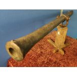 18th/19th C rampart cannon with swamped muzzle and centre pivot, with timber stock and mount (