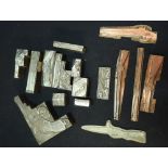 Three boxes containing sixteen 19th C metal gun and military related printing blocks for pistols,