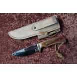 Sheffield made sheath knife with 4 inch blade, brass crosspiece and two piece grips, complete with