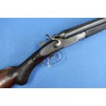 12 bore English double barreled top lever hammer gun with 30 inch barrels and semi pistol grip stock