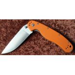 Outis pocket knife with folding blade and belt clip