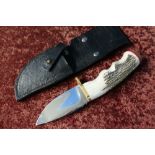 Bear USA sheath knife with 3 1/2 inch broad blade and Sambar horn grip complete with leather sheath