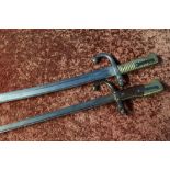 Two late 19th C French bayonets, the first with two piece wooden grips and the top with T shaped