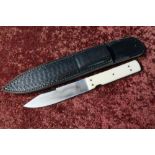 CX Lockwood Brothers of Sheffield steel bladed knife with ivorine two piece grips and leather sheath