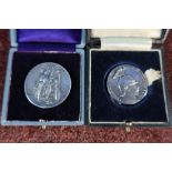 Two cased commemorative medallions including a silver Great European War Peace token and a 1914