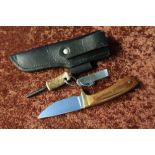 Sheffield made 2 1/2 inch bladed sheath knife with brass crosspiece and two piece grips, complete