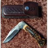 Ridged pocket knife with 3 inch folding blade and leather belt pouch