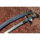 19th C Indian Tulwar type sword with 28 1/2 inch curved blade with engraved detail to the hilt and