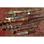 Long bladed Kris, a sceptre, an Indian brass hilted sword, unusual iron bulls head mace, a Sheffield
