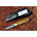 2 inch bladed knife with antler grip and leather sheath