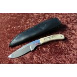 Harry Boden sheath knife with 2 3/4 inch blade, two piece antler horn grip and leather sheath