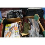 Box containing a selection of various gun slips, air gun magazines, fobs, accessories, snap caps,