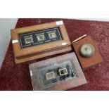 Mahogany cased three sectional servants bell with glazed panel marked M B Harrison Waterloo House