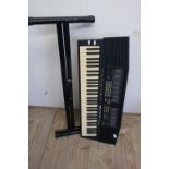 Yamaha keyboard on stand