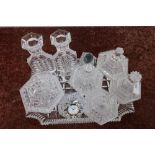 Cut glass dressing table tray and selection of various glass dressing table jars, candlesticks etc