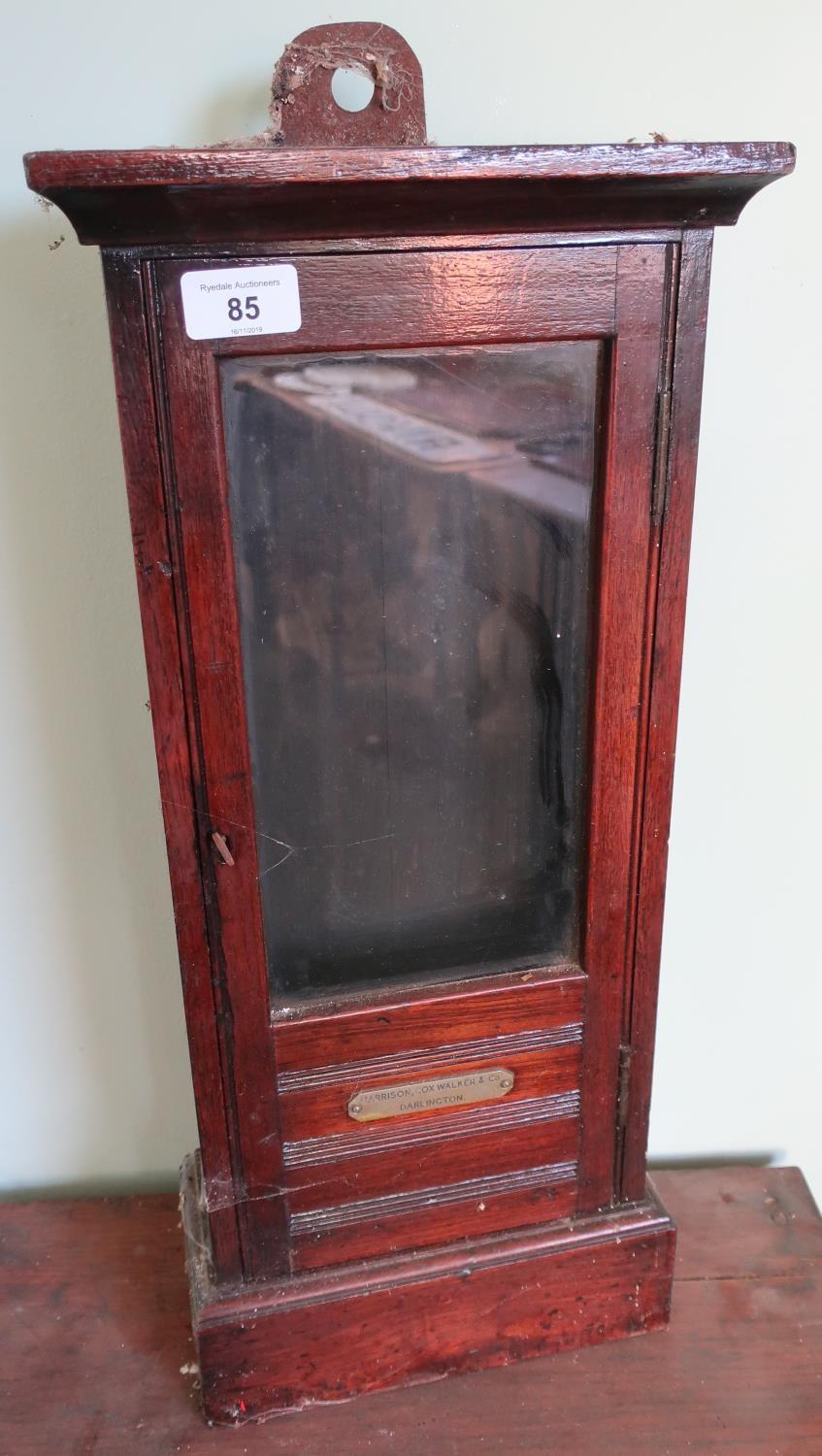 19th/20th C mahogany cased cabinet enclosed by a single glazed door with plaque (Harrison Cox,