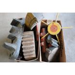 Two boxes containing a selection of various painted carved wood railway mold blocks for various