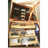 Three die-cast vehicle display cases, one with contents and a large selection of various boxed and