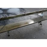 Railway type bench with cast metal supports and wooden planked seat and back (width 230cm)