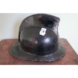 Vintage French leather and canvas fireman's helmet in black finish, complete with liner