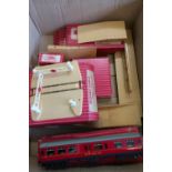 Selection of red boxed Hornby Dublo accessories including level crossings, buffers, points,