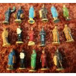 Box containing a small selection of 17 Hornby Dublo metal figures including various passengers,