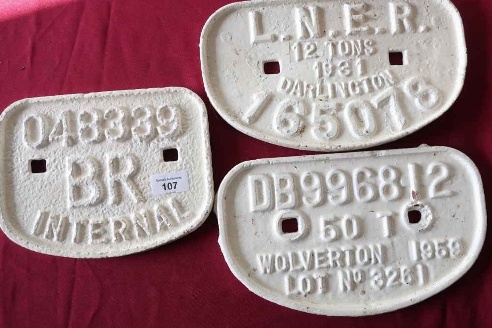 Group of three white painted cast metal railway wagon plates including LNER 12 tonne 1931 Darlington