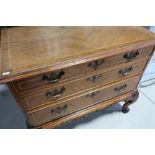 Gillows walnut chest of three drawers with crossbanded detail on carved cabriole supports, the top