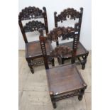 Set of three similar carved oak dining chairs with solid seats, on bobbin turned supports