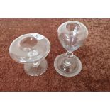 Two 19th C glass oil lamps with circular bases (heights 10cm and 15cm) (2)