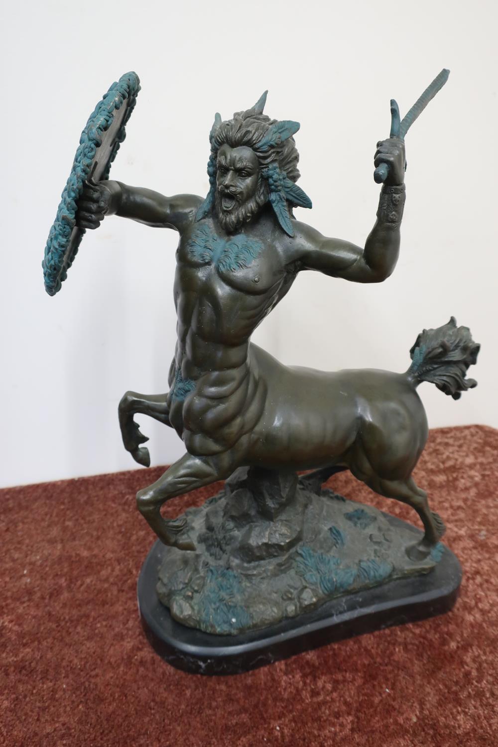 Modern bronze figure of a Centaur with sword and oval snake entwined shield, mounted on marble