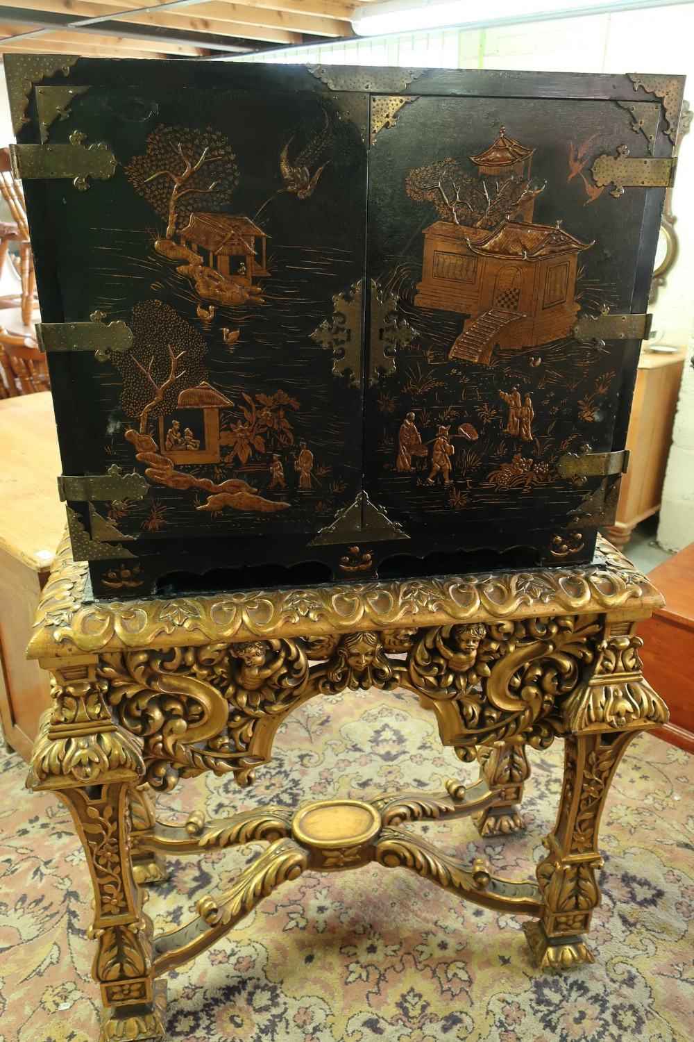 19th C Chinoiserie cabinet on stand, lift off cabinet enclosed by two panelled doors with brass