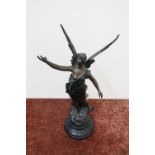 19th/20th C French bronze figure of a semi clad winged angel on turned base (height 50cm)