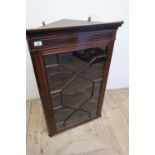 Edwardian mahogany inlaid corner cupboard enclosed by single glazed door, with three shelves to