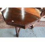 Oak octagonal dining table with carved detail, X shaped stretcher and barley twist supports (