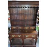 Quality reproduction oak dresser with three tier raised back with three short drawers above two
