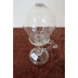 19th C glass lace makers oil lamp with circular base, loop handle, rib column and glass globe (
