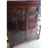 Quality early- mid 20th C mahogany shelved cabinet with four adjustable shelves enclosed by two