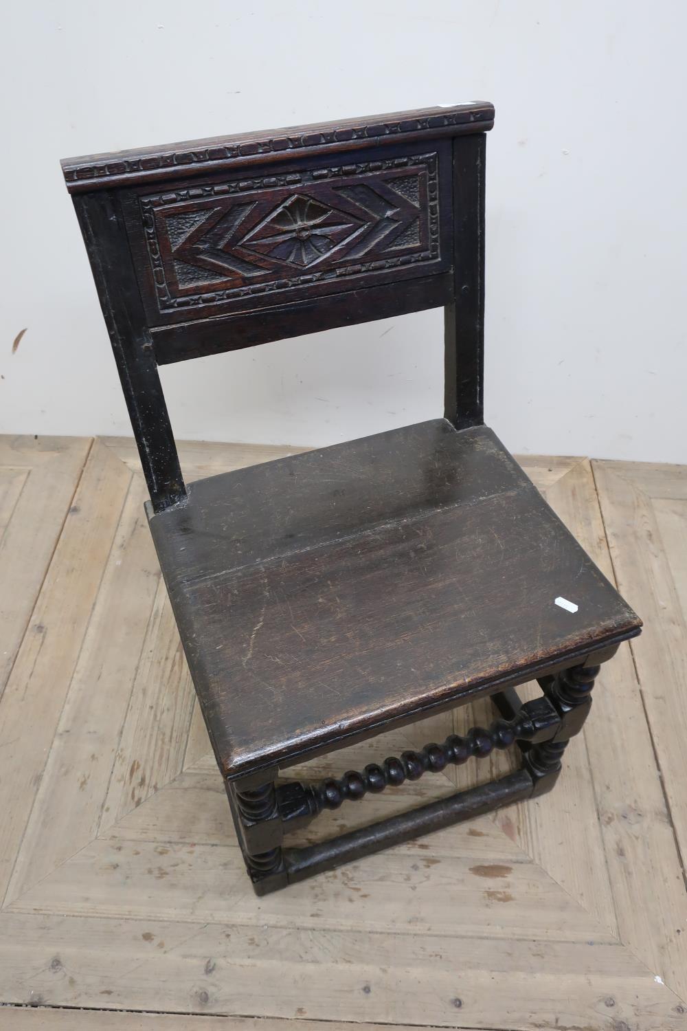 18th C oak carved panel back dining chair with planked seat and turned supports