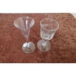 Two 19th C drinking glasses, one of tapering trumpet form on circular base (height 17cm), the