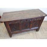 18th C oak coffer with twin planked lift up top and carved and panelled detail to the front and