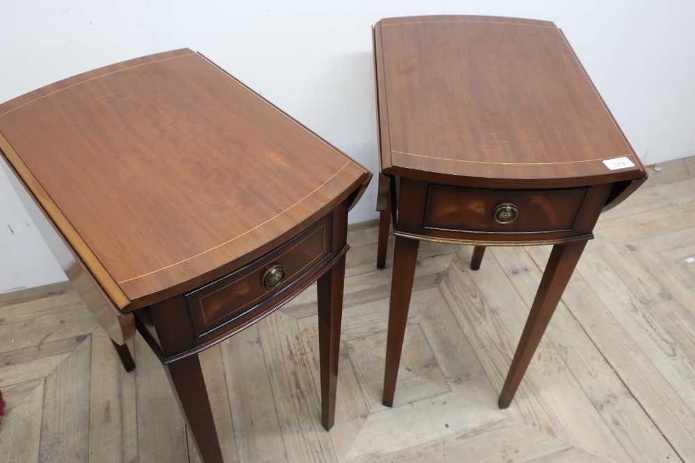 Pair of reproduction mahogany drop leaf occasional tables with single drawer, on square tapering