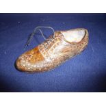 Unusual cold painted bronze figure of a brogue type left brown shoe (length 12.5cm)